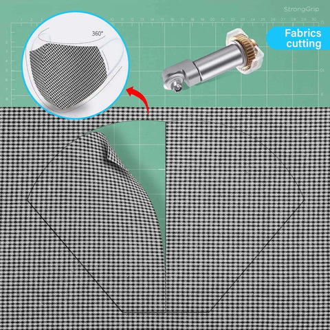 Front view: rotary blade drive housing for Maker 3/4; gear and blade visible, cutting houndstooth fabric on green mat