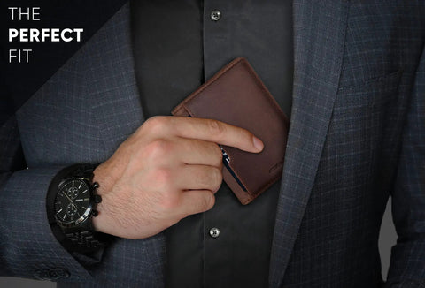 Man holding Ultra Slim Leather RFID Blocking Minimalist Wallet For Men Everyday Carry Front Pocket Bifold Travel Ready With Premium Full Grain Leather Texas Brown And 12 Month Warranty