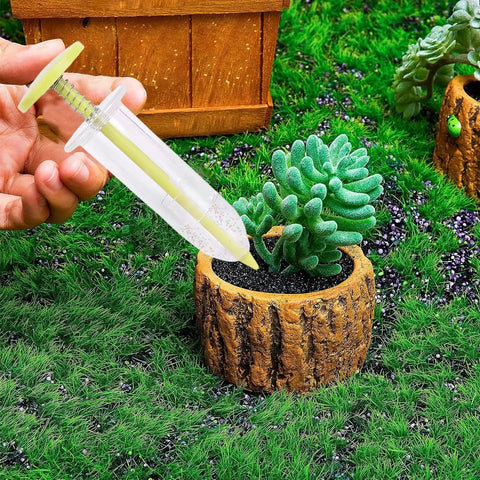 Go To Seed Spreader And Sowing Tool For Gardeners With Ergonomic Design Reusable Seeder in use near potted plant on grass