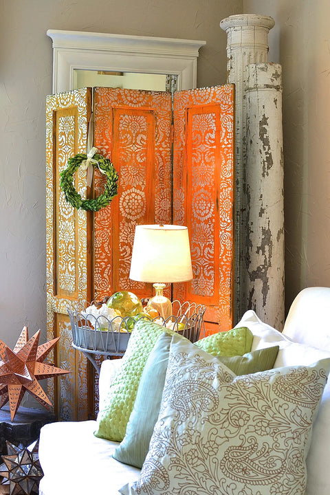 Interior decor scene with a rustic orange room divider, lamp, and sofa with pillows; potential use for Rust Activator For Metal Effects 1 Gal PA904 Water Based Acidic Solution To Pre Treat Reactive Iron Metallic Paint Easy Application Converts Metal To Realistic Rust Look Ideal For Diy Projects And Crafts.