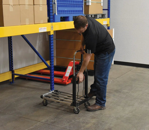 Person using Aluminum Platform Cart With 300 Lb Capacity 28 Inch Long Deck And 16 Inch Wide 9 Inch Overall Height in warehouse