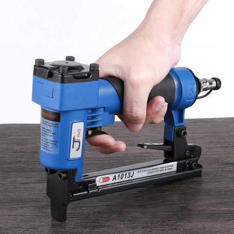 Heavy Duty 14 Gauge Brad Nailer With Touch Strike Safety adjustable exhaust, lightweight die cast aluminum body in hand.