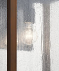 Outdoor Wall Light Sconce In A Sleek Dope Black Finish With Clear Seeded Glass, 17 Inches High By 10 Inches Wide close-up view