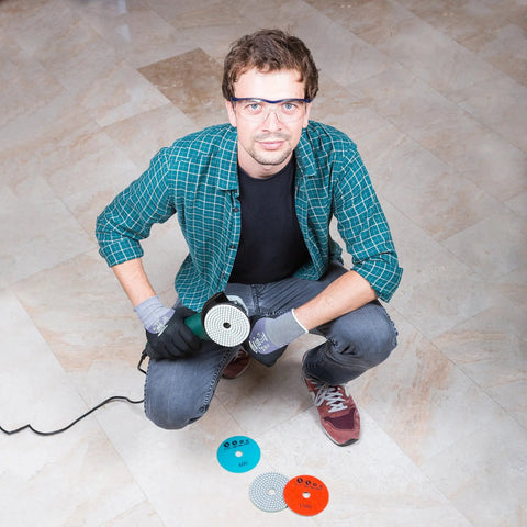 Man using 4 Inch Diamond Pro Grade Polishing Pads Wet And Dry Set Of 11 Plus 1 Backer Pad for granite marble and concrete on floor