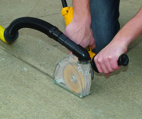 Universal Dust Shroud For Grinders 4 And 5 Inch With Diamond Blade Captures Up To 99 Percent Of Dust in use on concrete surface
