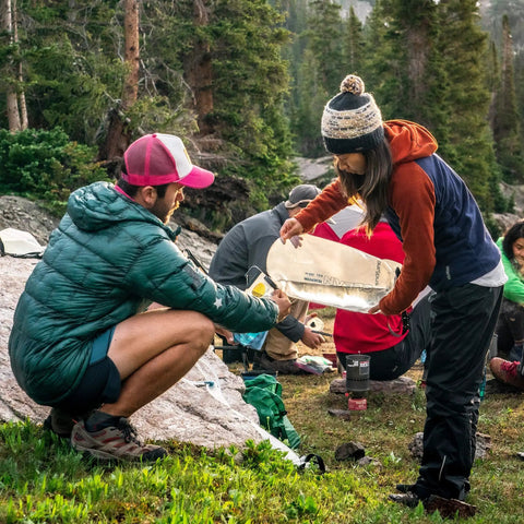 Replacement 6.0 Liter Water Reservoir Kit For GravityWorks System during outdoor trip, people using clean reservoir.
