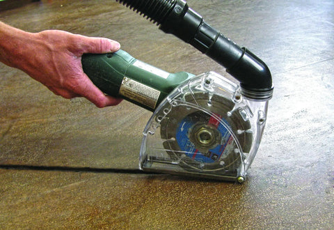 Universal Dust Shroud For Grinders 4 And 5 Inch With Diamond Blade Captures Up To 99 Percent Of Dust in use, showing clear window attachment.