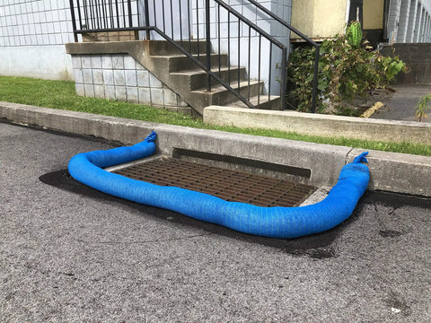 Sediment Filter Sock For Erosion Control And Storm Drain Protection, 5 Inch Diameter By 10 Foot Length, Blue, installed on curb drain