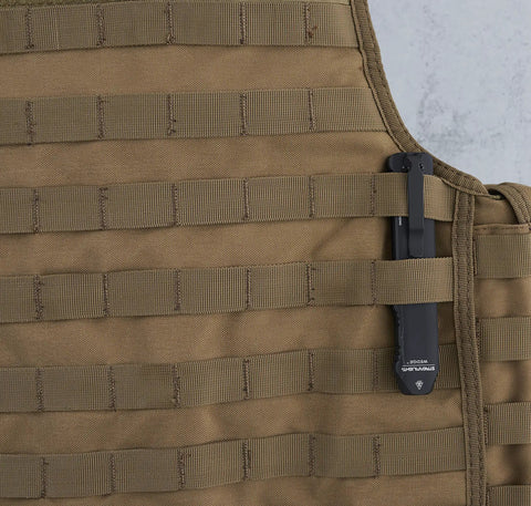 Wedge EDC Flashlight 1000 Lumen THRO Burst clipped to a tan tactical vest