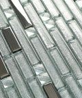 Close-up of sparkling silver crystal glass tile mosaic with metallic shine for kitchen backsplash, bathroom, and shower walls.