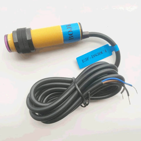Photoelectric Sensor Switch E3F-DS30C4 with 300mm sensing distance and 18mm thread, shown with connecting wires