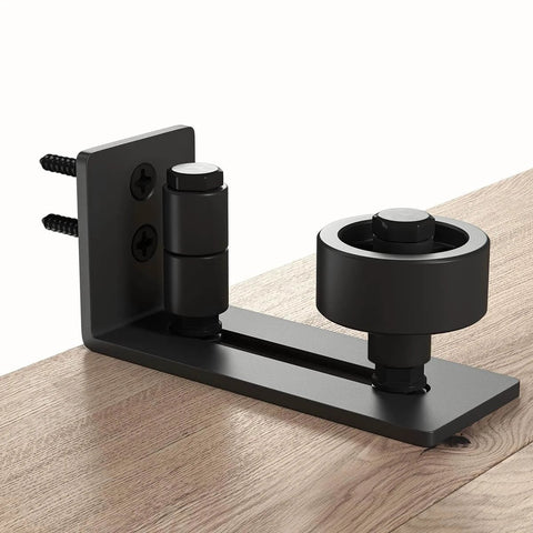 Sliding barn door floor guide with adjustable bottom rollers, flush low profile design, solid steel & POM nylon, frosted black finish.