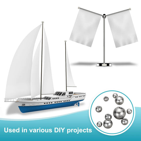Sailboat model with decorative flags and stainless steel balls for DIY projects, highlighting Ball Nuts Knob M12x38mm In 304 Stainless Steel.