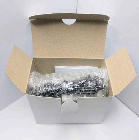 3/4 inch NPT flow totalizer packed in a cardboard box with bubble wrap
