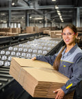 Worker holding cardboard with 30 Pcs 1/2 Inch Roller Ball Transfer Bearings Carbon Steel Ball Casters in a conveyor factory setting