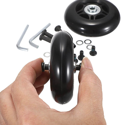 Hand holding 75mm x 23mm Luggage Wheels Replacements Set of 2 Mute Suitcase Replacement Wheels with Black Screws Axles Bearings in the background