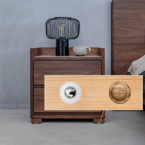 Close-up of 20 Pieces Mini Ball Transfer Bearings 1/3 Inch Nylon Cup with Stainless Steel Ball on wooden furniture