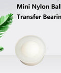 Mini nylon ball transfer bearing with white body for smooth 360-degree rotation use in conveyors and transfer tables.