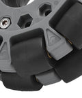 Close-up of Omni Wheel for Robot 100mm 360 Degree Omnidirectional Plastic Wheel showing rubber rollers and brass bearings.