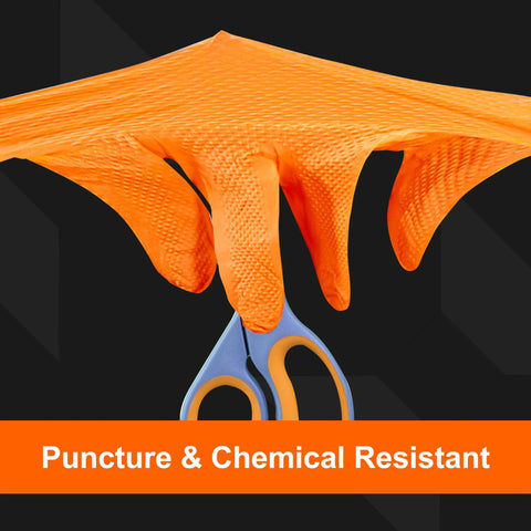 Close-up of Orange Nitrile Heavy Duty Gloves 8 Mil Raised Diamond Grip Large 5 Boxes Of 100 showing puncture resistance with scissors.