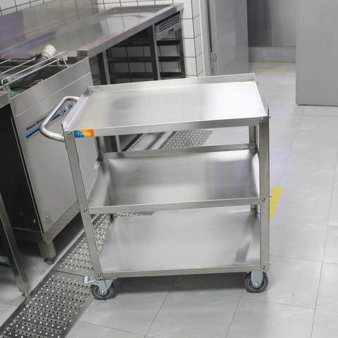 Three Tier Stainless Steel Utility Cart For Restaurant Hospital Lab And Hotel Use With Beefed Up Heavy Duty Wheels And Easy Handle Food Service Trolley 19W x 31L x 34H Treshin, shown in a kitchen setting.