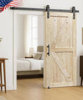 60in x 84in Unfinished British Brace Knotty Barn Door with 10FT J Shape Sliding Hardware Kit, installed in bedroom entry